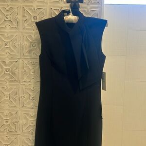 Elegant navy dress for work, cocktails and more. Lovely unfussy ‘tie’ at neck